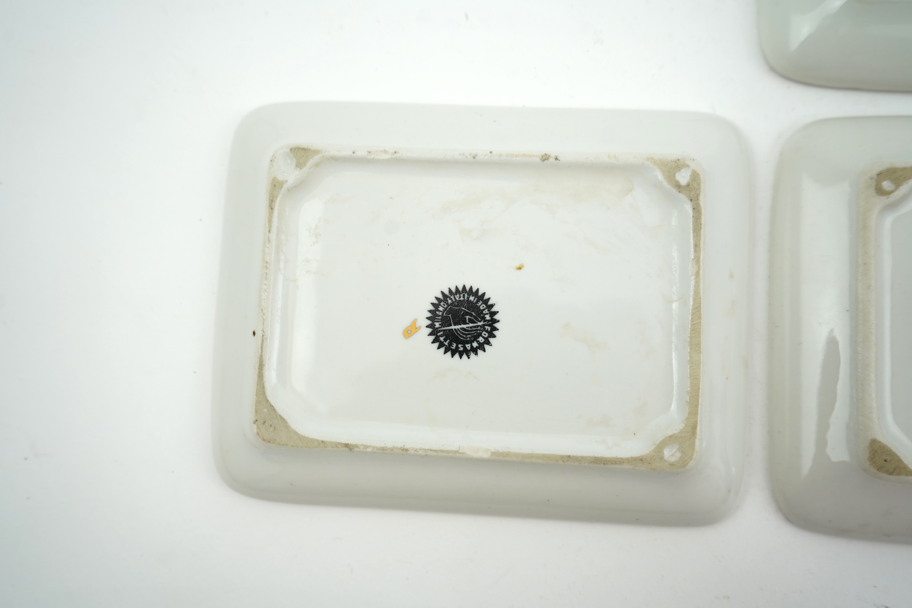 Piero Fornasetti (Italian, 1913-1988): A collection of Fornasetti desk items and dishes